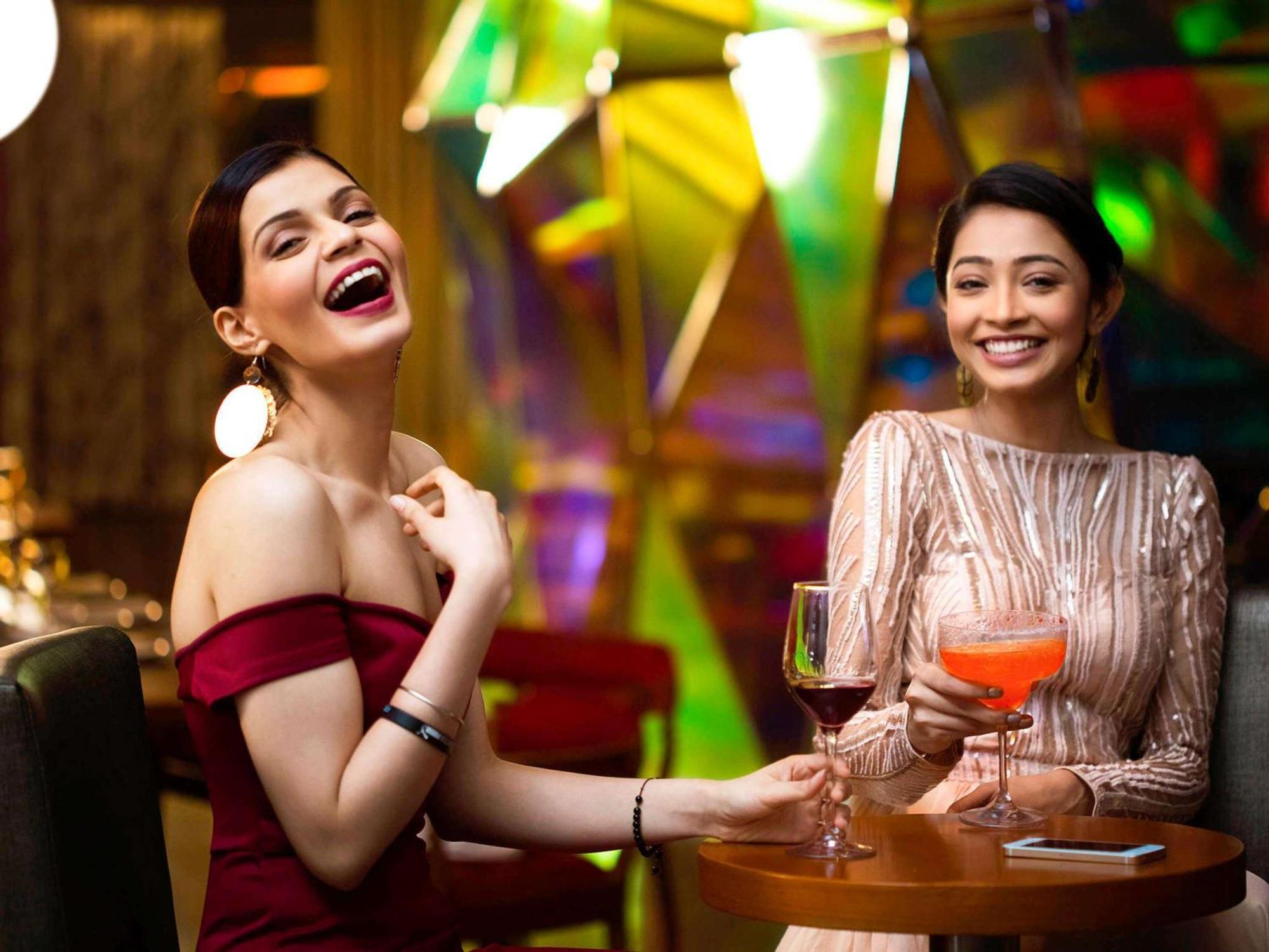 Novotel Kolkata Hotel And Residences Экстерьер фото Two women socializing