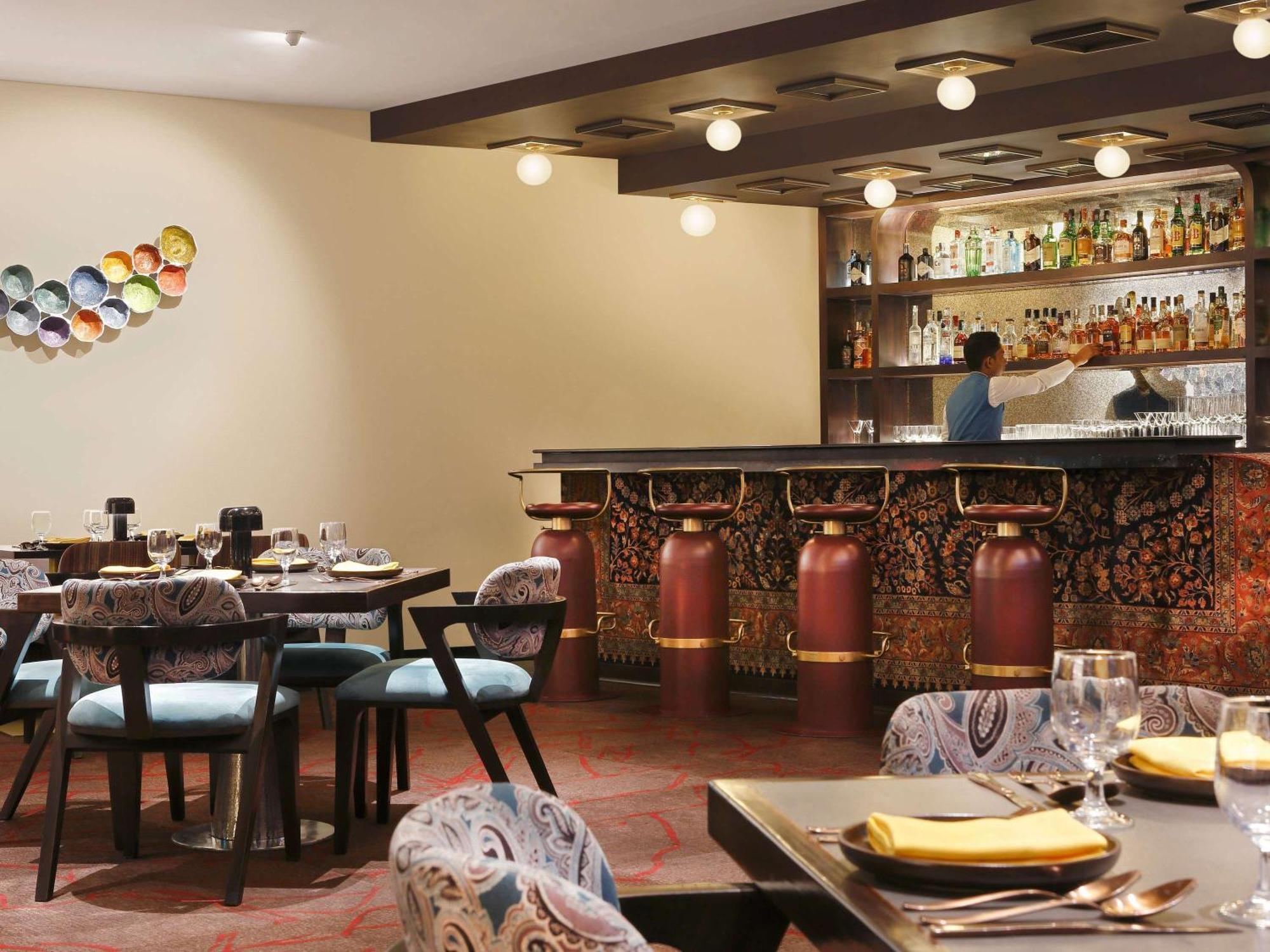 Novotel Kolkata Hotel And Residences Экстерьер фото The bar at the restaurant